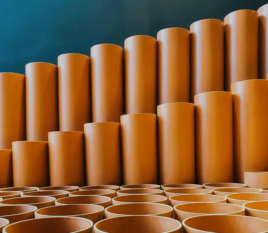 Close-up of orange PVC pipes